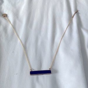 Gold chain necklace with a rectangular black stone